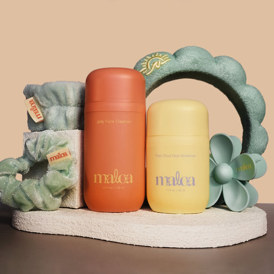 MALOA terracotta Jelly Face Cleanser, yellow Triple Cloud Moisturizer and No Drip Kit which includes a teal MALOA branded spa headband, wristies, scrunchies and a flower claw hair clip. 