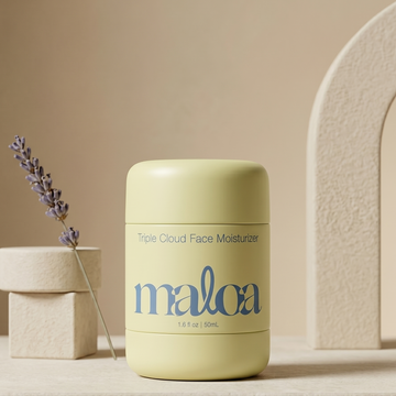 Light yellow skincare product with 'maloa' branding on a neutral background