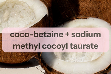 A close-up photo of cut coconuts with a translucent pink label overlay reading 'coco-betaine + sodium methyl cocyl taurate' in dark text.